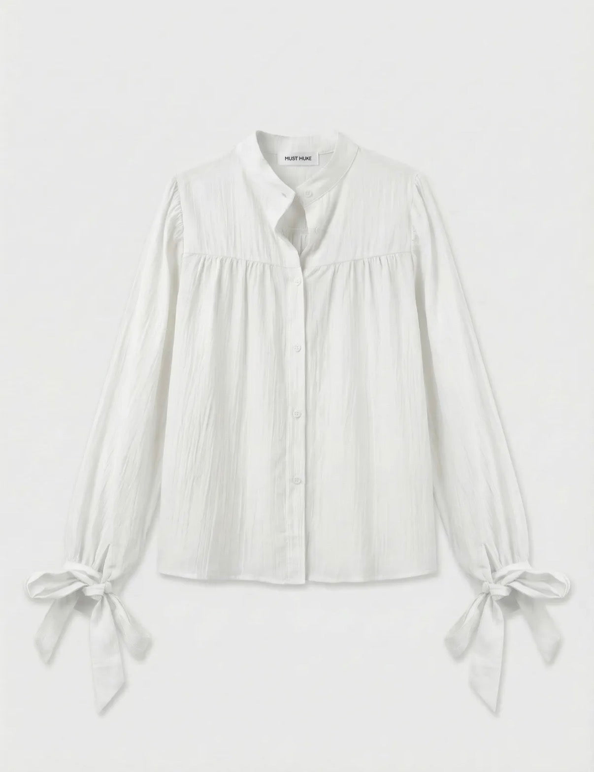 Witte blouse met strikdetails