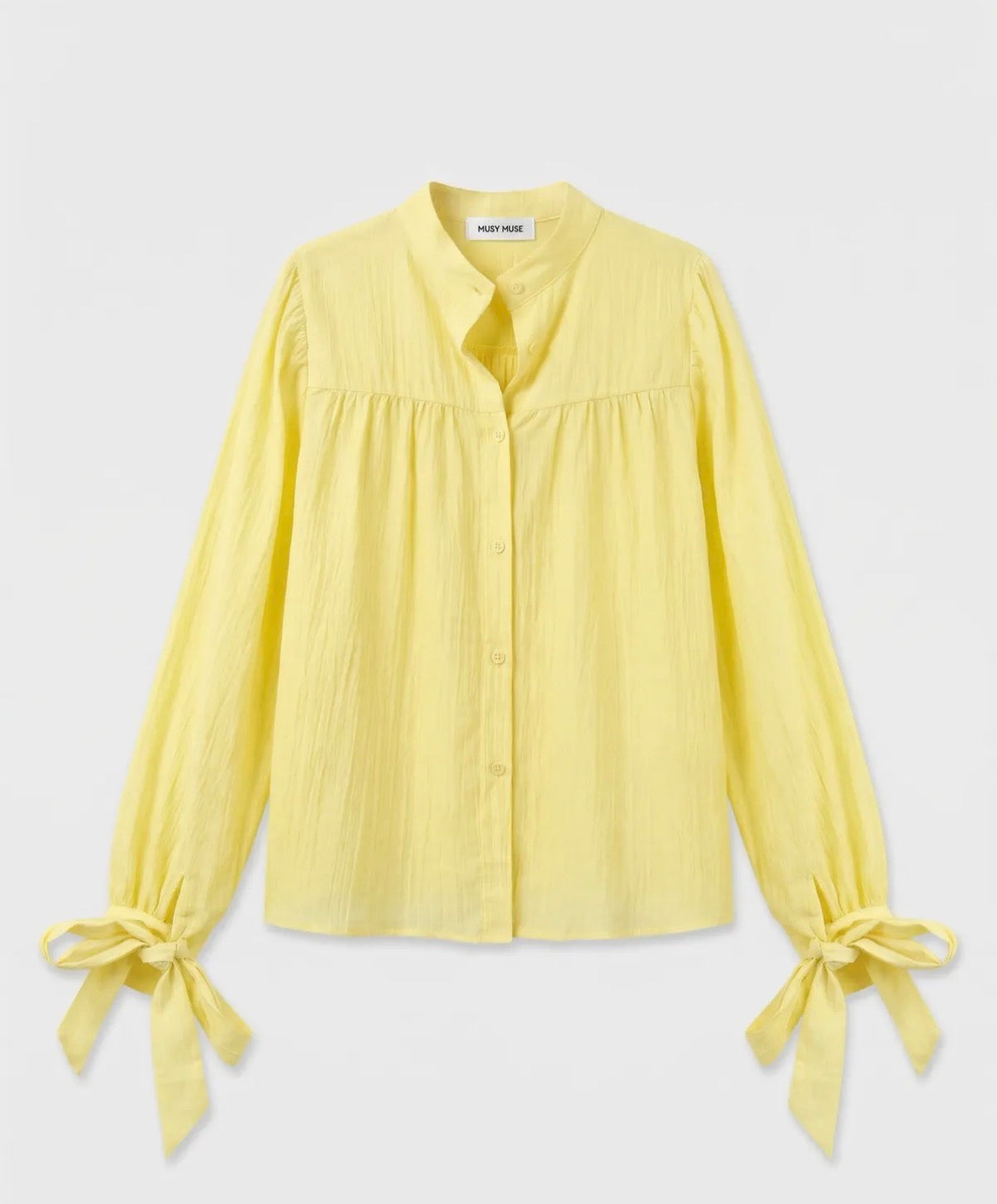 Gele blouse met strikdetails