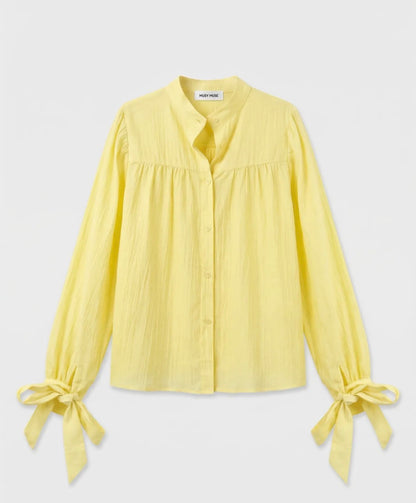 Gele blouse met strikdetails