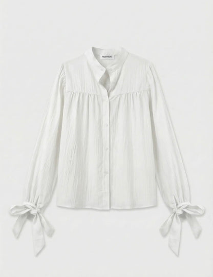 Witte blouse met strikdetails