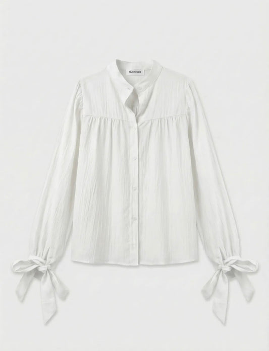 Witte blouse met strikdetails